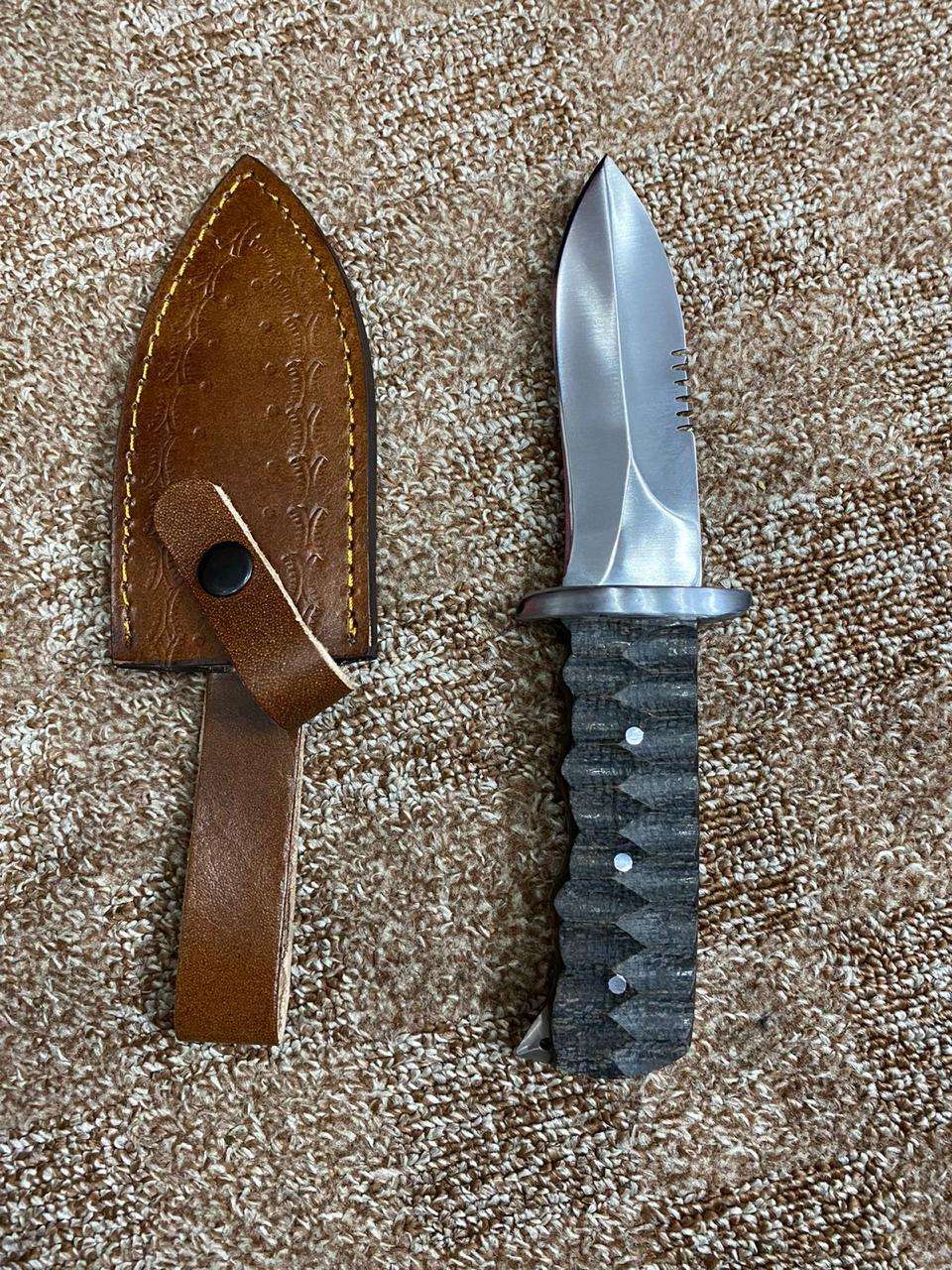 Tactical Fixed-Blade Knife with Textured Handle and Leather Sheath